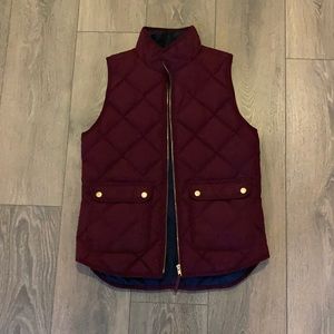 Maroon vest with navy lining and gold details